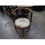 An Edwardian mahogany corner chair with modern upholstered seat