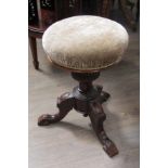 A Victorian stool with swivel top