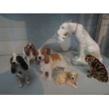 Seven animal figures including a Szeiler Spaniel and a Border Fine Arts Golden Retriever pup