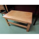 A stained beech occasional table on stretcher base