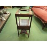 A George III mahogany three tier gentleman's washstand with central drawer