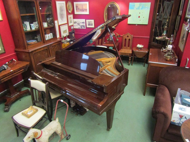 An early 20th Century baby grand piano