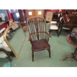 Stamped "H.S." circa 1860 an elm and oak stick back Windsor elbow chair the hoop back with fret