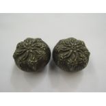 A pair of white metal lidded trinket boxes,