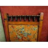 A three fold Victorian screen, spindle top over foliate fabric panels,