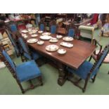 An oak refectory table, carved under frieze,