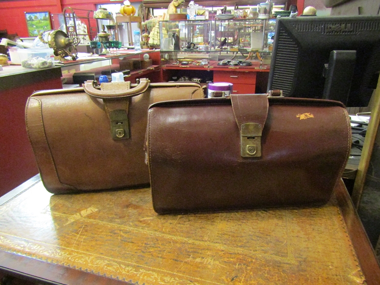 Two leather Gladstone bags