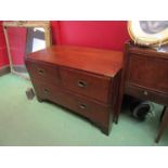 A campaign oak two short over one long drawer bed end chest,