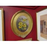 A gilt framed oval oil, still life of flowers, WF monogram and dated 1904.