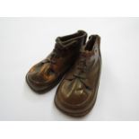 A pair of worked copper vintage style boots, 13cm long,