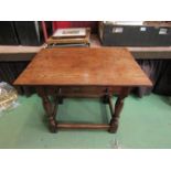 In the manner of Titchmarsh and Goodwin a 17th Century style plank top oak lamp table with single