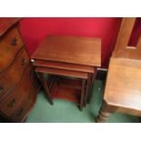 An Edwardian nest of three graduating mahogany occasional tables,