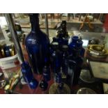 A quantity of Bristol blue bottles