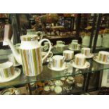 A Midwinter "Sienna" coffee set comprising of coffee pot, milk and sugar bowls,