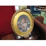 A gilt framed oval oil, mounted to board, portrait after J.B. Greuze.