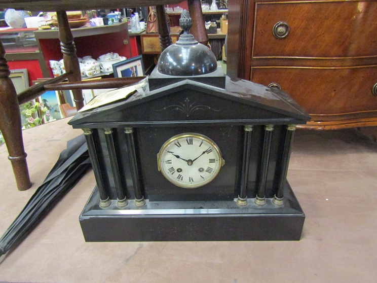A Victorian black slate mantel clock of architectural form, with key,