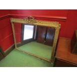 A pair of ornately gilt and gesso framed wall mirrors with ribbon detail,