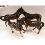 Four Beswick brown horses "Bois Roussel Racehorse", "Swish tail horse",