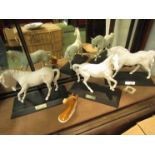 Three Beswick white matt horses on plinths, "Spirit of the Wind",