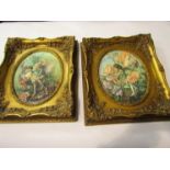 A pair of reproduction ornately gilt framed prints of fairies