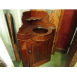 An early Victorian flame mahogany corner washstand,