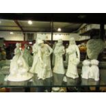 Five Royal Worcester style cream glaze figures including "Sweet Dreams" and "First Dance" together