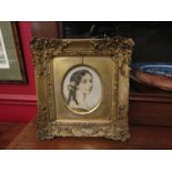 An ornately gilt framed and glazed etching portrait of young lady in oval mount,