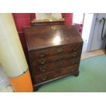 A George III flame mahogany bureau the fully fitted interior over four long drawers and bracket