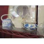 Two antique stoneware teapots and a "Willow" pattern teapot,