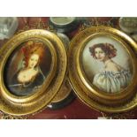 A pair of miniature oval portraits in gilt frames