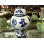 An Oriental lidded bulbous ginger jar form lamp base with figural design