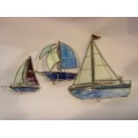 Three coloured glass model sail boats