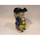 A Victorian Staffordshire Toby jug with hat lid,