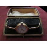 A lady's 9ct gold wristwatch in leather case