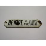 A "Beware of the Dog" enamel sign,