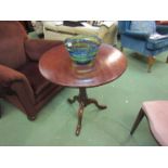 A 19th Century mahogany and oak circular tilt top wine table on cannon barrel turned column and