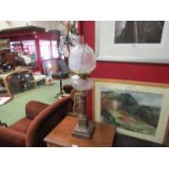 A Victorian oil lamp on pillar and stepped base,