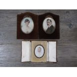 WILLIAM HILL THOMSON (1882-) Three framed miniatures on ivory, portraits of a family.