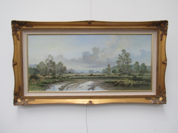 W. REEVES (XX) 20th Century British Heath Land with trees to background, oil on canvas, gilt frame.