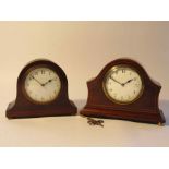 Two Edwardian mahogany cased desk timepieces of arched form with enamelled Arabic dials,