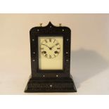 A 19th Century French ebonised mantel clock, possibly re-painted dial,