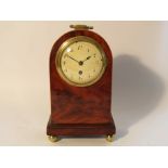 A 19th Century mahogany and satin inlaid mantel timepiece of arched form,