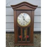 An early 20th Century oak cased ATO electric wall clock with Arabic silvered dial signed ATO H&B,