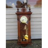 A late 19th Century walnut cased Vienna style spring driven wall clock with Gustav Becker movement,