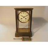 A late 19th Century French brass and four glass mantel clock with 8-day movement by L.