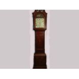A George III oak and mahogany longcase clock with scrolled pediment to hood,
