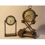 Two early 20th Century silver plated mantel clocks of drum form on frame supports,