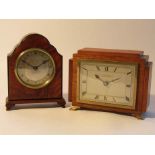 A mid 20th Century oak and mahogany desk timepiece with silvered rectangular Roman dial,