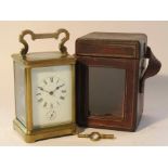 A mid to late 19th Century brass cased carriage clock with rack strike and alarm mechanisms,
