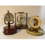 Three early to mid 20th Century electric clocks including Bulle and German examples,
